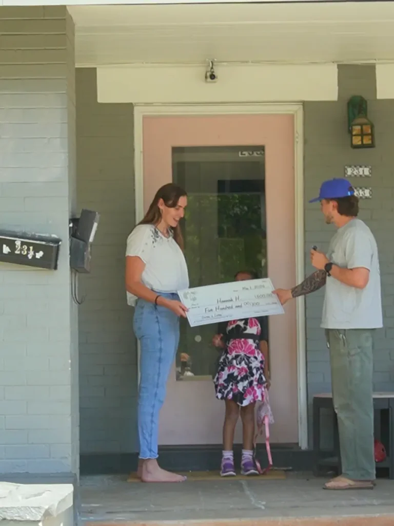 Hannah Getting her check - Vertical